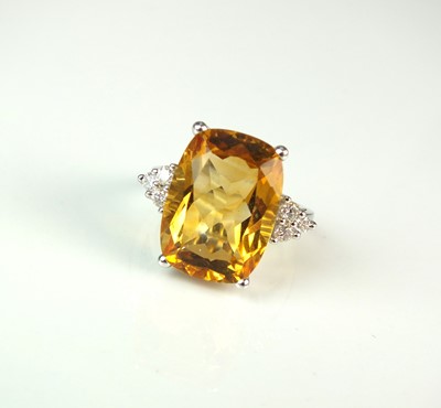 Lot 59 - An 18ct white gold citrine and diamond ring