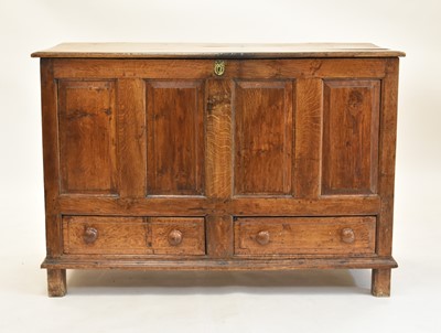 Lot 554 - An early 19th century oak panelled mule chest