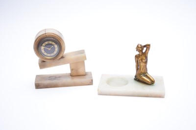 Lot 506 - An art deco gilt metal figural pin tray, an alabaster desk clock and a gilt metal figure of a dancing girl