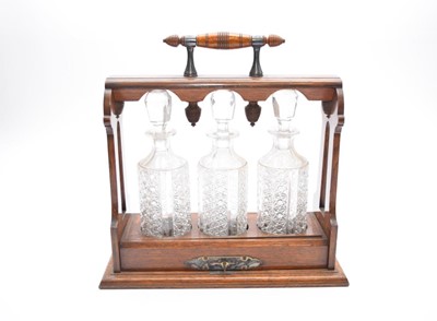 Lot 371 - A late Victorian Oak and EP mounted tantalus