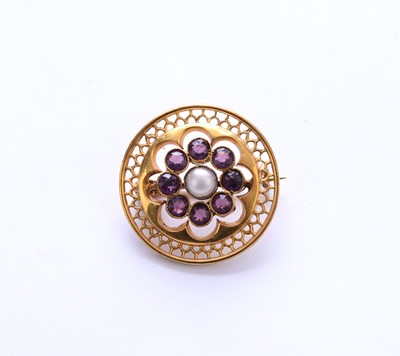 Lot 81 - A seed pearl and purple paste set brooch