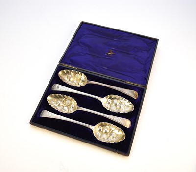 Lot 48 - A cased set of four George III silver spoons