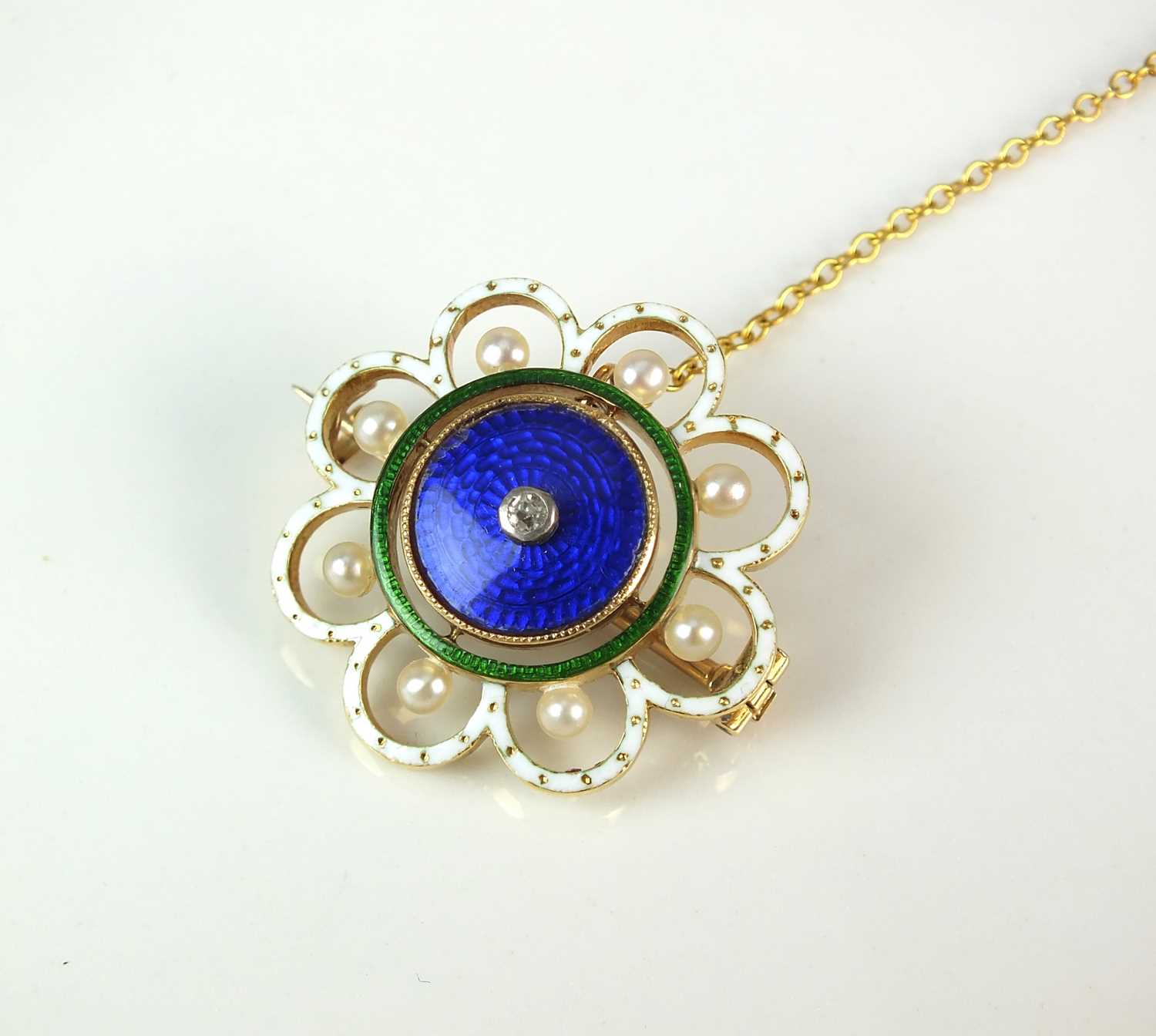 Lot 25 - A diamond, seed pearl and enamel brooch