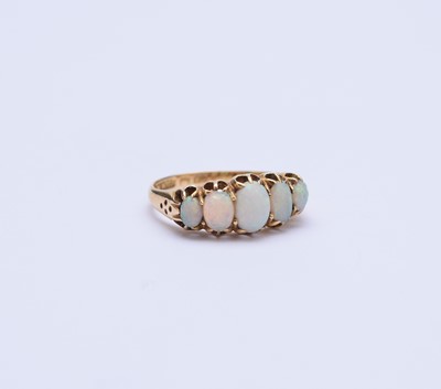 Lot 89 - An 18ct gold graduated five stone opal ring