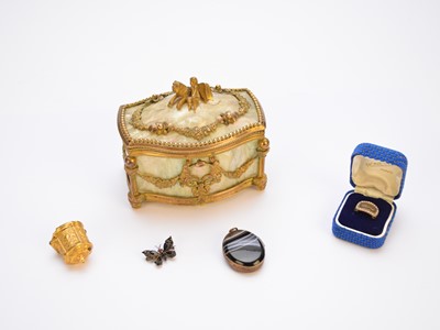 Lot 95 - A 19th century seed pearl and black enamel mourning ring