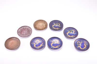 Lot 477 - A set of eight 'stages of production' cloisonne dishes