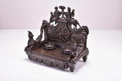 Lot 556 - A late 19th century bronze desk standish