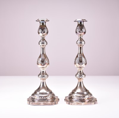 Lot 25 - A pair of George V silver candlesticks