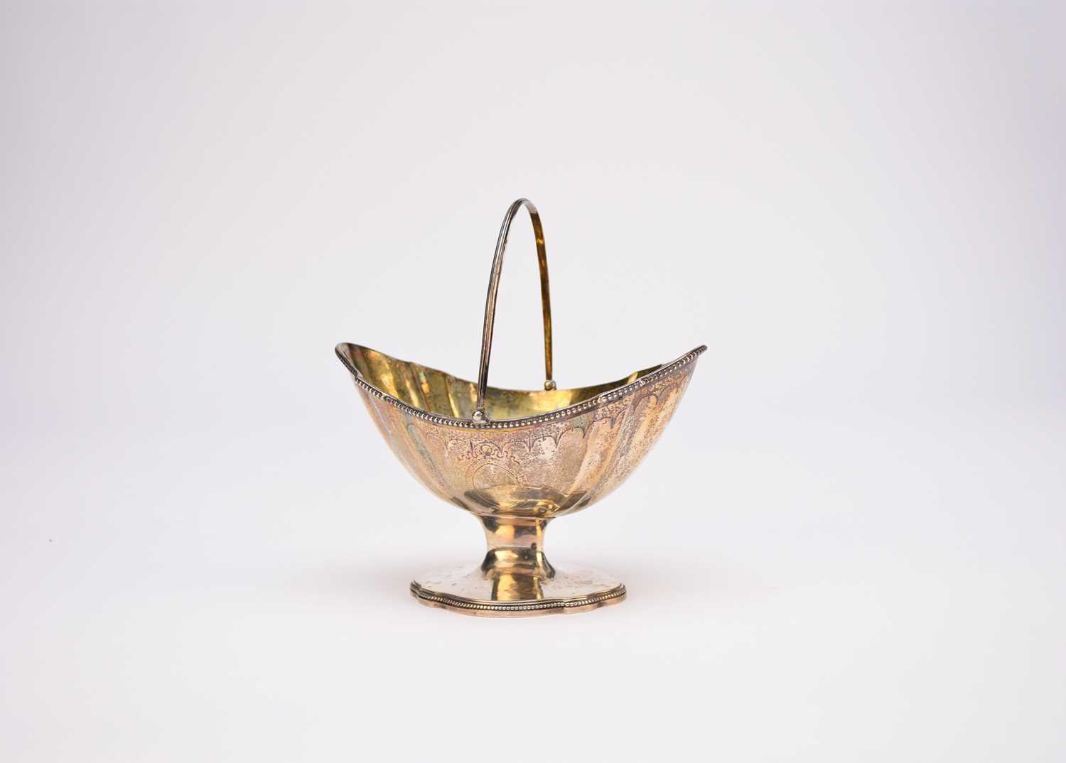 Lot 2 - A George III swing handled silver sugar bowl
