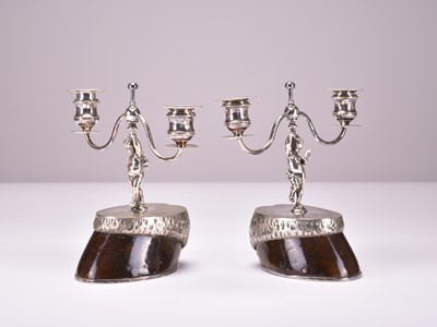 Lot 16 - A pair of 19th century silver plated horses hoof candelabra