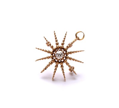 Lot 106 - A diamond set starburst brooch/pendant