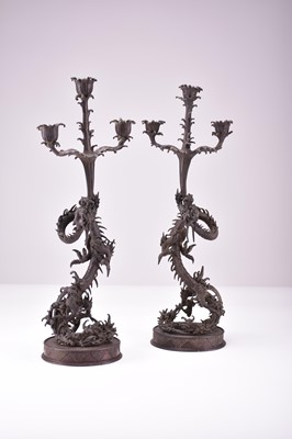 Lot 629 - A pair of Japanese bronze dragon candelabra, Meiji era