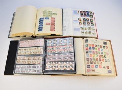 Lot 235 - A collection of stamps in four albums