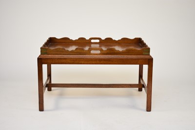 Lot 572 - A 20th century mahogany campaign butler's tray on stand