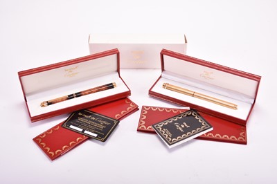 Lot 358 - Two Must de Cartier ballpoint pens