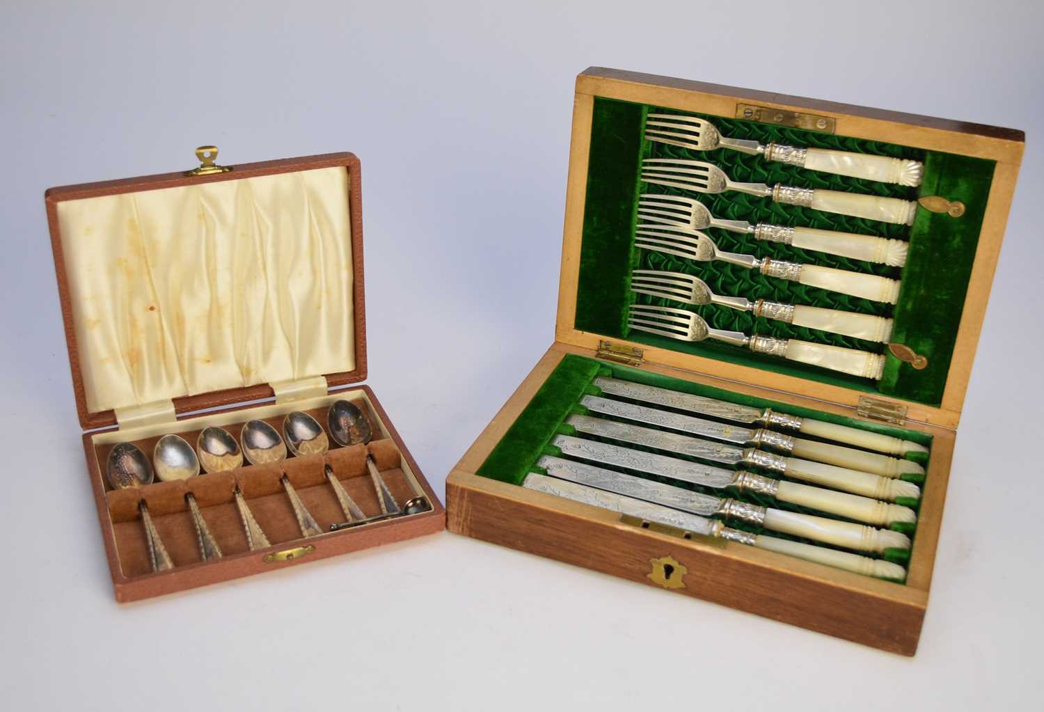 Lot 55 - A cased set of knives and forks and a cased set of coffee spoons