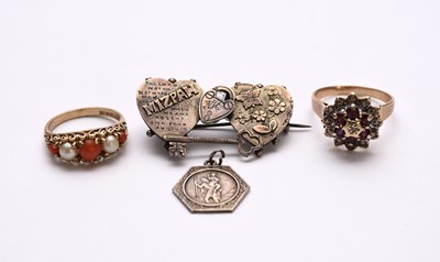 Lot 61 - Two rings, a brooch and a charm