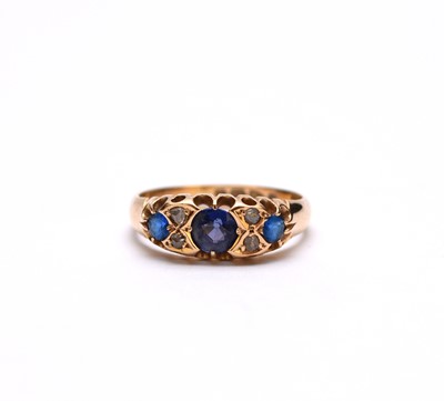 Lot 64 - A Victorian 18ct gold seven stone sapphire, diamond and blue paste ring