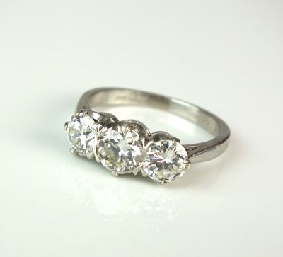 Lot 302 - A platinum three stone  synthetic diamond ring