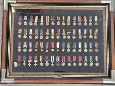 Lot 55 - A pair of Danbury Mint framed sets of miniature British Gallantry and Campaign medals