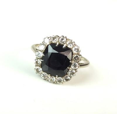 Lot 79 - A sapphire and diamond cluster ring