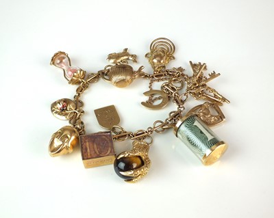 Lot 91 - A 9ct gold bracelet with attached charms