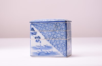 Lot 103 - A Japanese blue and white sectional pot and cover, Meiji era