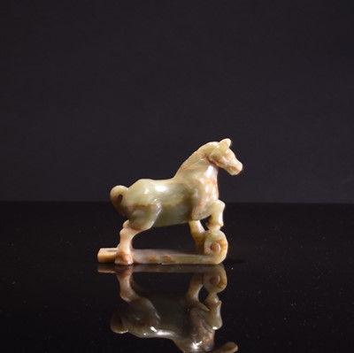 Lot 75 - A Chinese jade figure of a standing horse, late Qing Dynasty