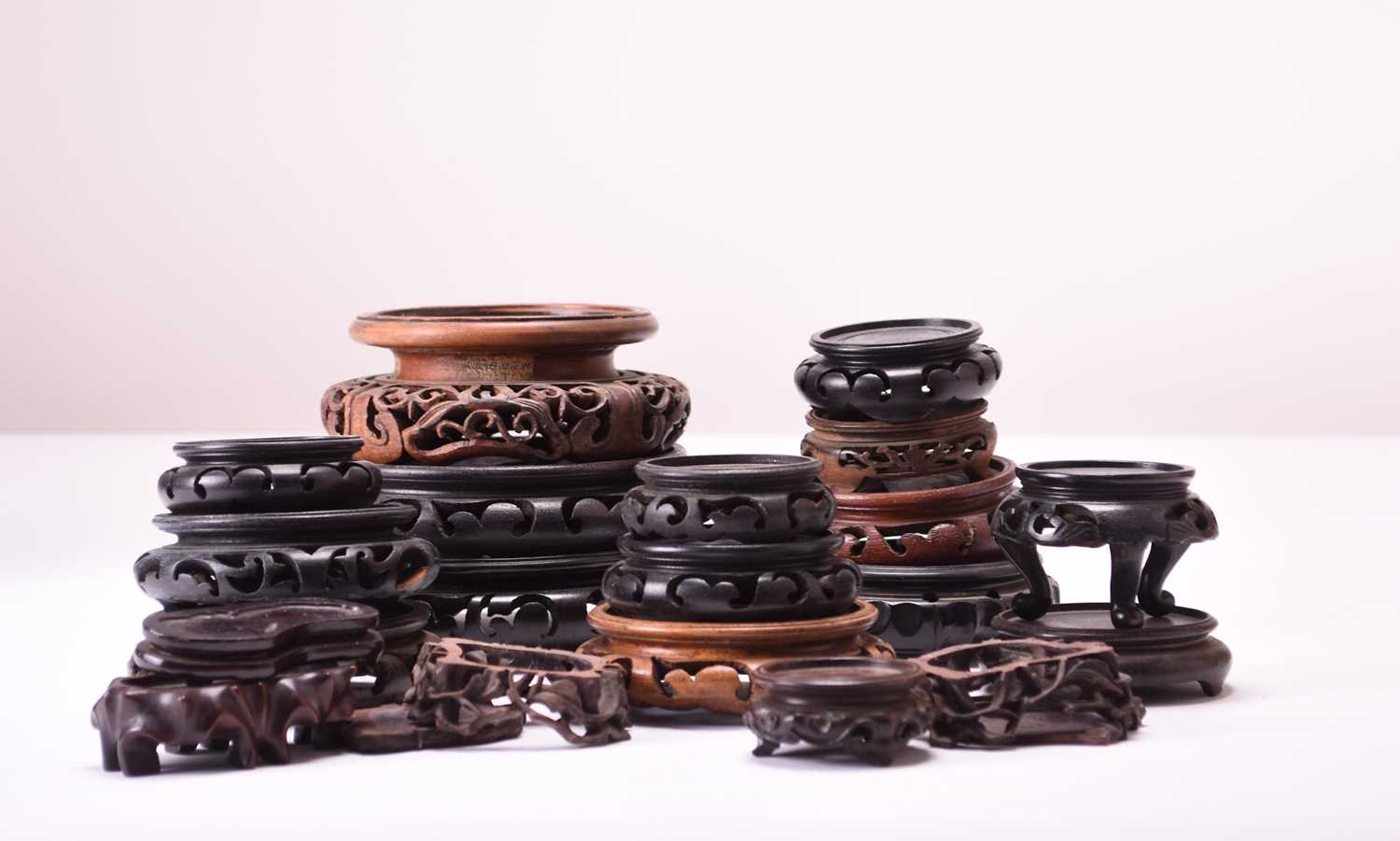 Lot 70 - A collection of Chinese hardwood vase stands