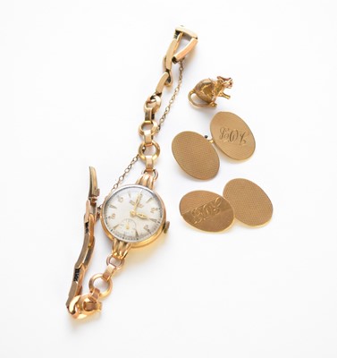 Lot 104 - A pair of cufflinks, a wristwatch and a charm