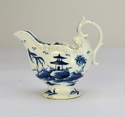 Lot 106 - A Derby porcelain 'Cannonball' dolphin cream boat, circa 1765-9