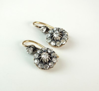 Lot 54 - A pair of early 20th century diamond cluster earrings