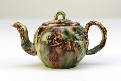 Lot 7 - A small Staffordshire teapot and cover c.1750, Whieldon glaze
