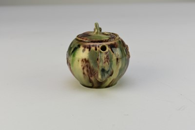 Lot 7 - A small Staffordshire teapot and cover c.1750, Whieldon glaze