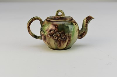 Lot 7 - A small Staffordshire teapot and cover c.1750, Whieldon glaze