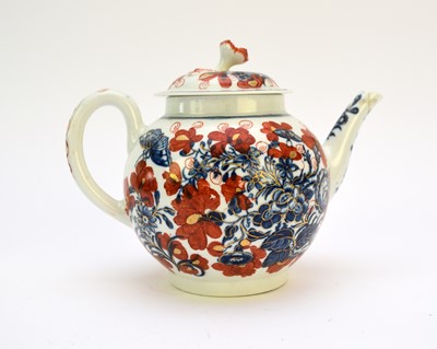 Lot 268 - A Worcester clobbered blue and white teapot and cover and Flight, Barr and Barr cream