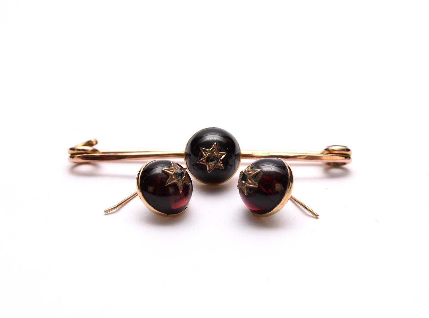 Lot 112 - A pair of cabochon garnet and rose cut diamond earrings and a bar brooch