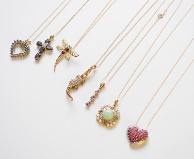 Lot 159 - A collection of pendants on chains