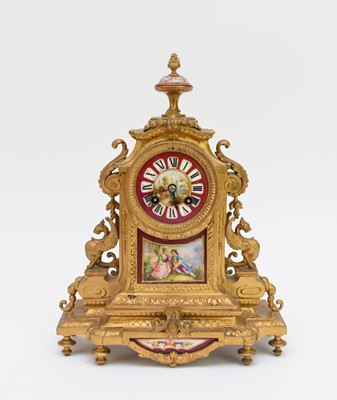 Lot 530 - A French gilt metal and porcelain mantel clock