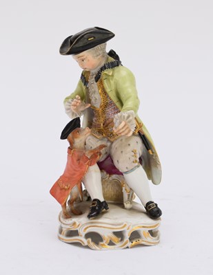 Lot 366 - A Meissen porcelain model of a boy playing tricks with a dog, 19th century