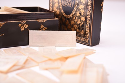 Lot 64 - A collection of Chinese mother-of-pearl gaming counters to a lacquer box