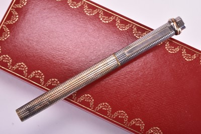 Lot 357 - A Cartier Pasha and a Must de Cartier ballpoint pens