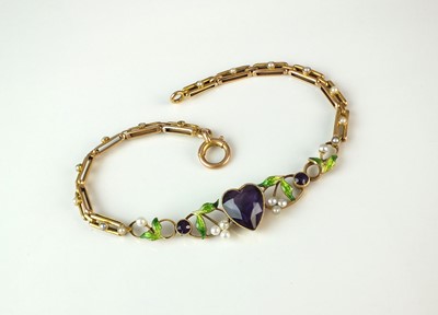 Lot 63 - An early 20th century amethyst, seed pearl and green enamel bracelet in the Suffragette colours