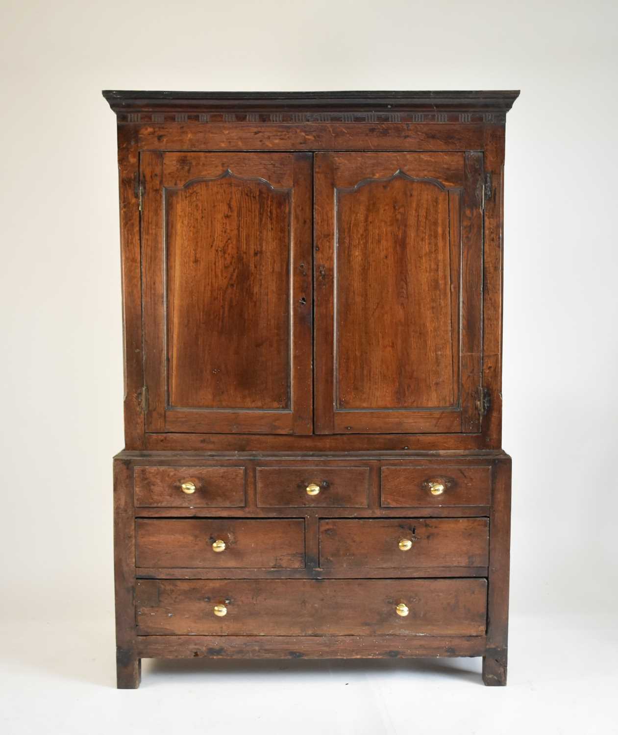 Lot 553 - A late 18th century oak livery cupboard