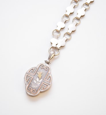 Lot 134 - A Victorian Aesthetic movement quatrefoil pendant suspended from decorative link chain