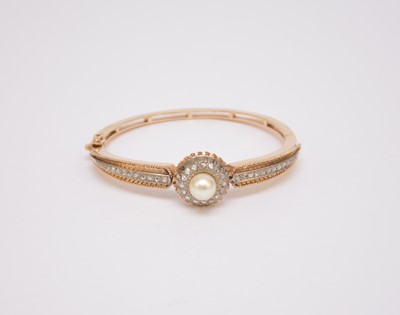 Lot 119 - A Victorian style cultured pearl and rose cut diamond hinged bangle