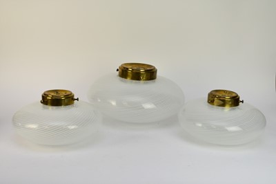 Lot 537 - A set of three mid-20th century laticcino glass ceiling light shades