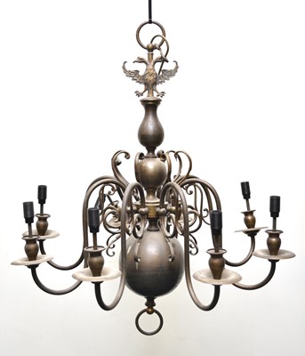 Lot 653 - Two Dutch style brass chandeliers