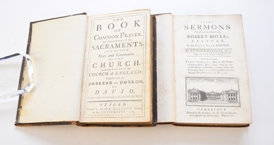 Lot 1083 - BOOK OF COMMON PRAYER, John Baskett, 1720. Ruled in red throughout. Contemporary panelled calf. With Book of Common Prayer, Oxford, 1798, contemporary red morocco.