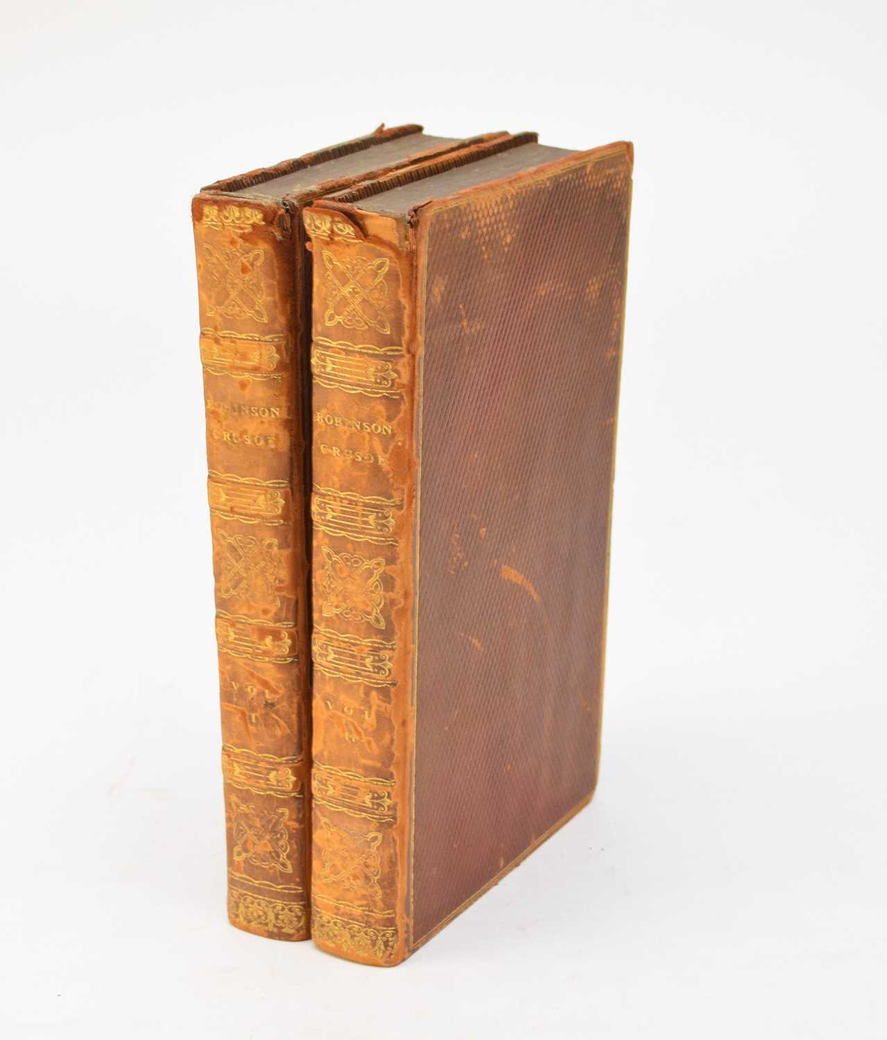 Lot 1084 - DEFOE, Daniel, The Whole Life and Strange Surprising Adventures of Robinson Crusoe, of York, Mariner. 2 vols. Logographic Press 1785. One plate in each vol. Contemporary diced calf.